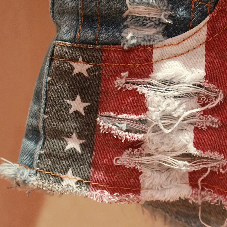 Women's low-rise denim shorts with American flag print, ripped design, perfect for summer by FLIPSTYLEZLLC.