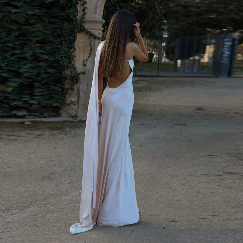 Backless lace-up maxi dress by Femstylo featuring ribbon accents and a sleeveless design, perfect for elegant evening occasions.