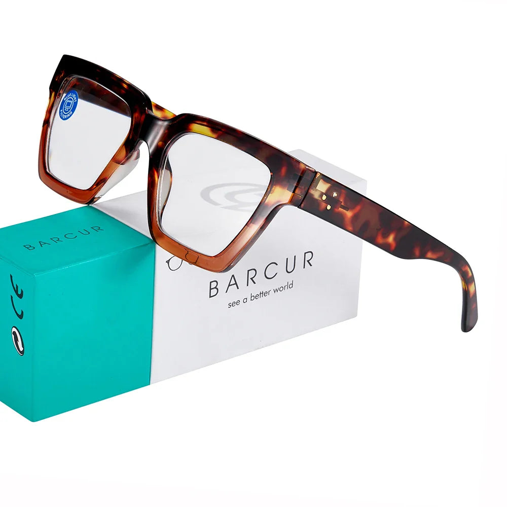 Stylish leopard pattern reading glasses by Stevvex with clear prescription lenses, rectangular shape, and fashion color options.