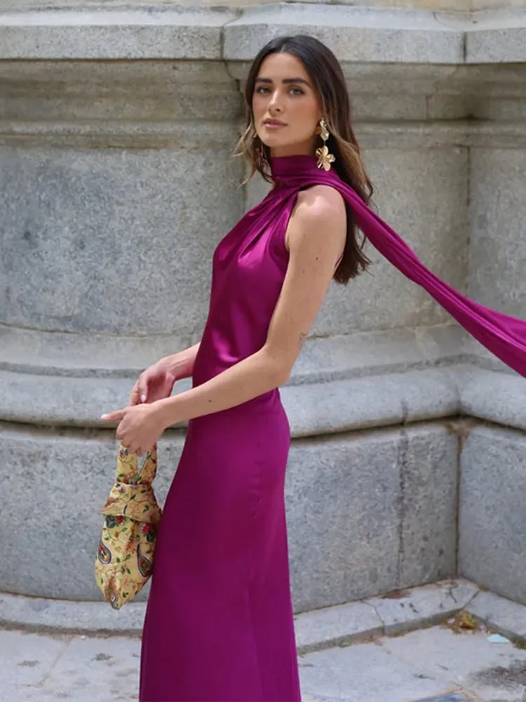 Backless lace-up maxi dress by Femstylo, sleeveless evening gown with ribbon details, perfect for parties and formal events.