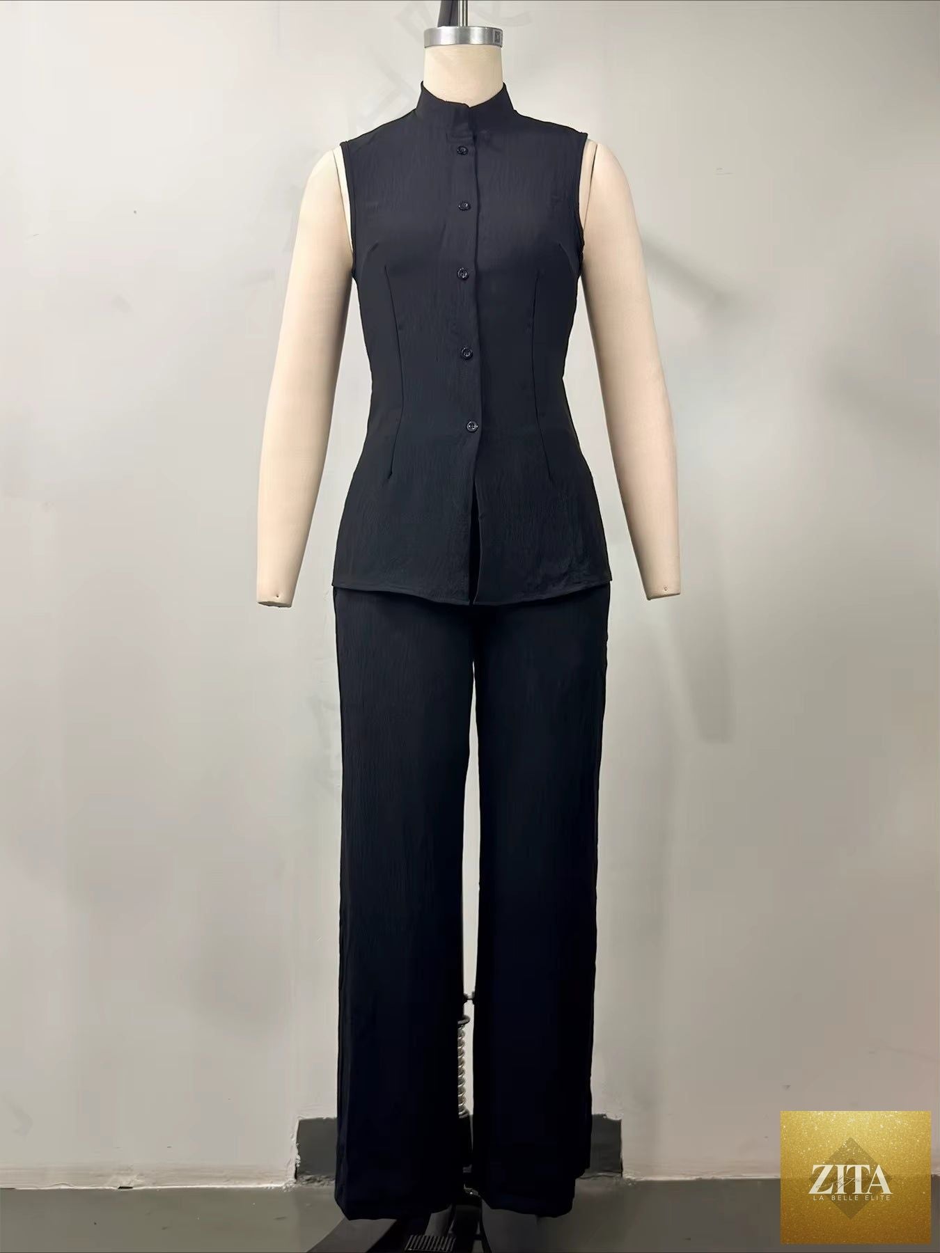 Women's MERIDGE two-piece set with a stand collar longline vest top and wide-leg trousers, shown in a stylish, casual outfit.