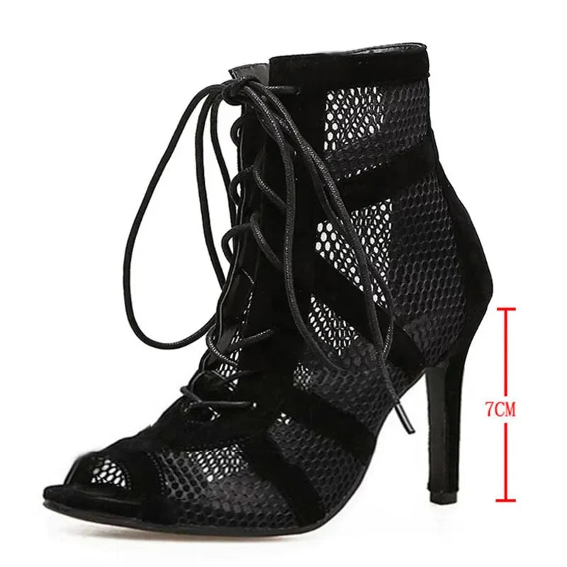 Black lace-up women’s high heels with open toe, ankle strap, thin heels, and hollow-out design, perfect for dancing and formal wear.