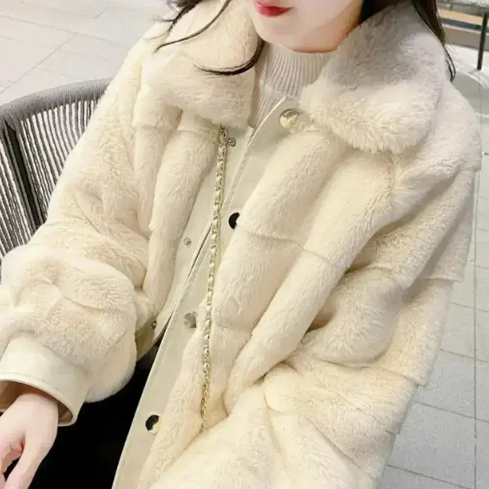 White faux fur jacket with vegan leather trimmed cuffs from Femstylo, featuring a cozy, stylish design in size S to XXL.
