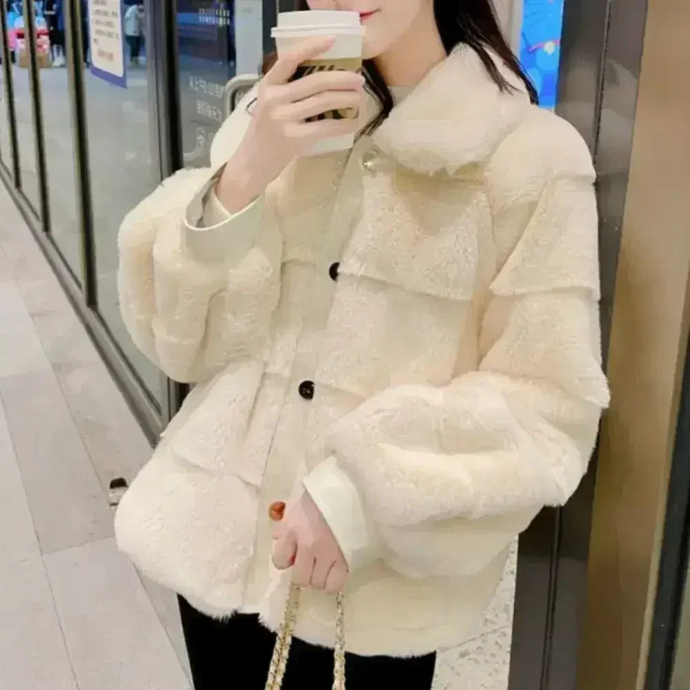 White faux fur jacket with vegan leather trimmed cuffs, available in small to extra-large sizes, stylish winter outerwear by Femstylo.