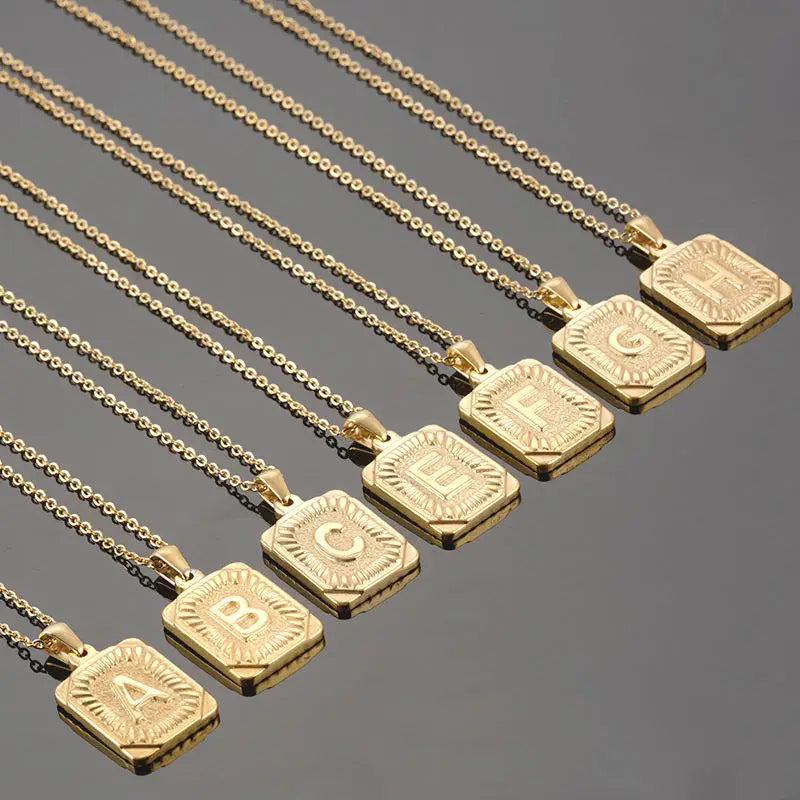 Stainless steel initial pendant necklace for women, featuring a square Cuban link charm with a letter, ideal for couples or everyday wear.