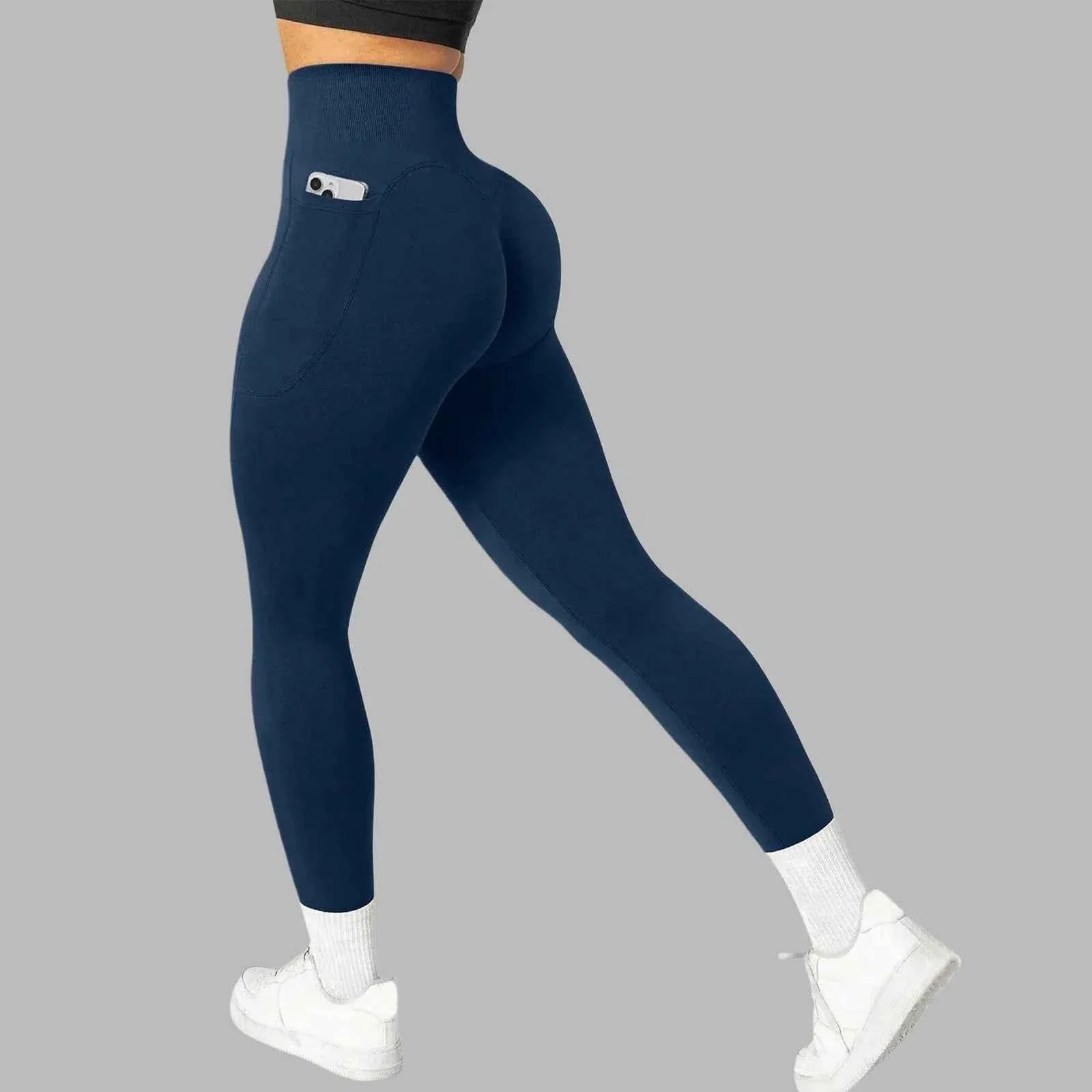 Women's seamless pocket yoga leggings by THRIXINE, showing a close-up of the soft, stretchy fabric with built-in side pockets.