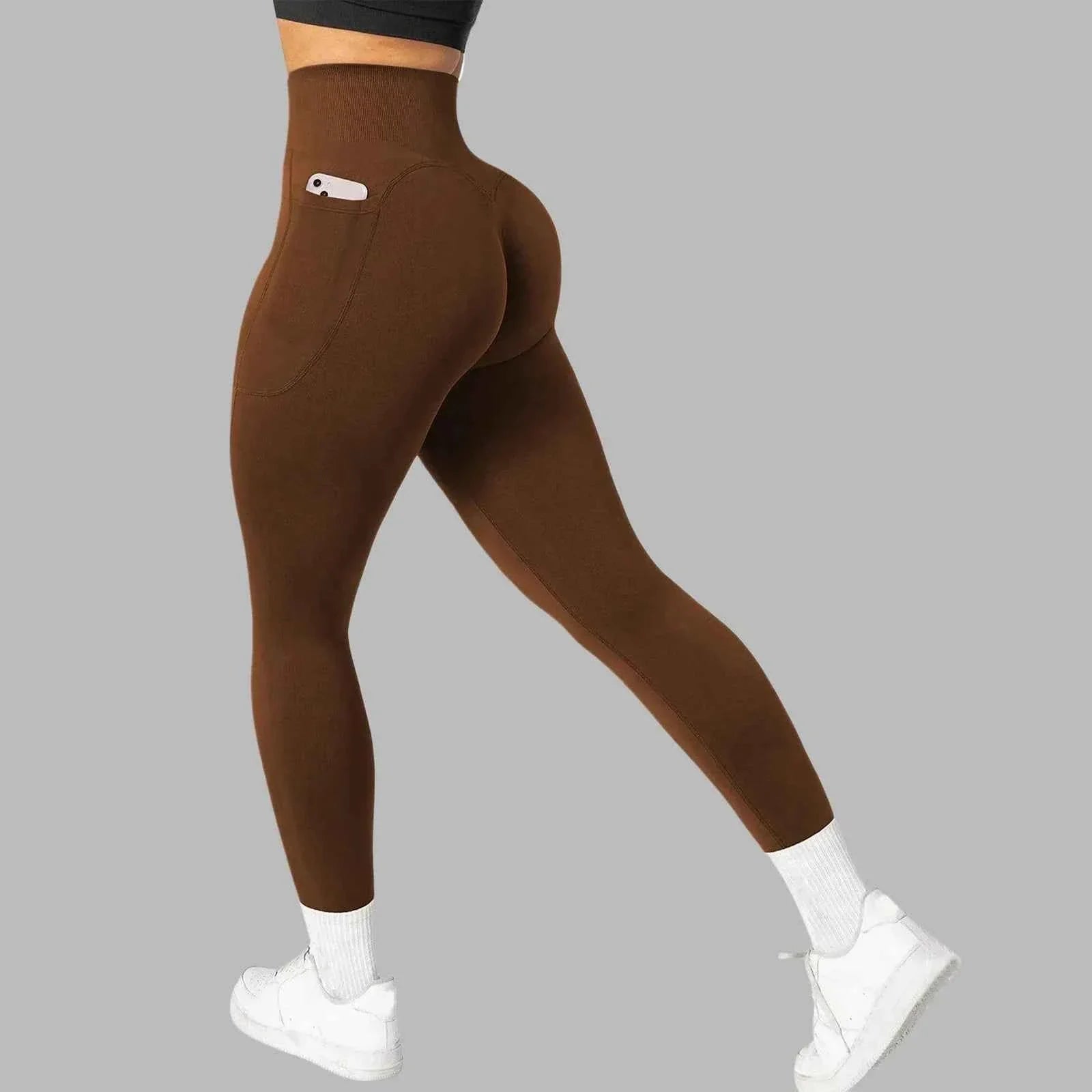 Women's seamless pocket yoga leggings by THRIXINE, showing a close-up of the comfortable, high-waisted design with side pockets.