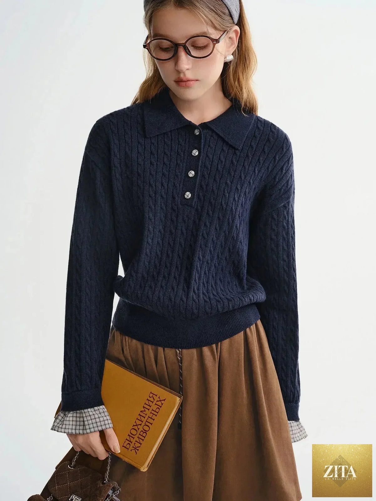 Loran twist knit cable stitch sweater in a cozy, textured design with ribbed cuffs and neckline, displayed on a neutral background.