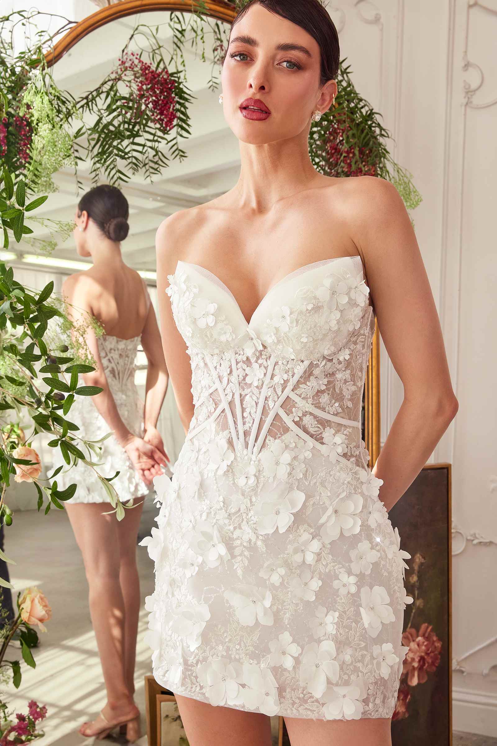 Off-white Andrea & Leo strapless midi bridal dress with deep sweetheart neckline, designed for elegant wedding looks.