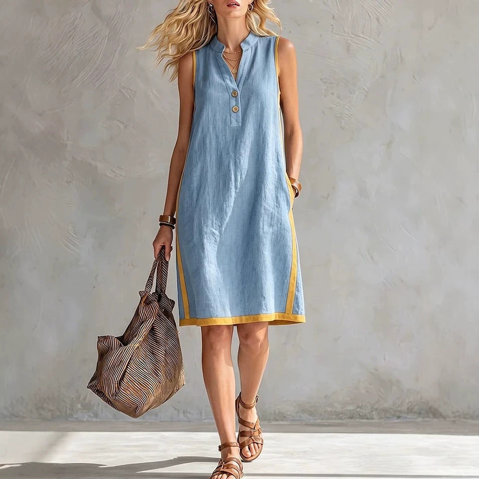 Women's sleeveless V-neck button-front A-line midi dress by FitiqueFit with chest pockets, casualwear, in a soft, flowing fabric.
