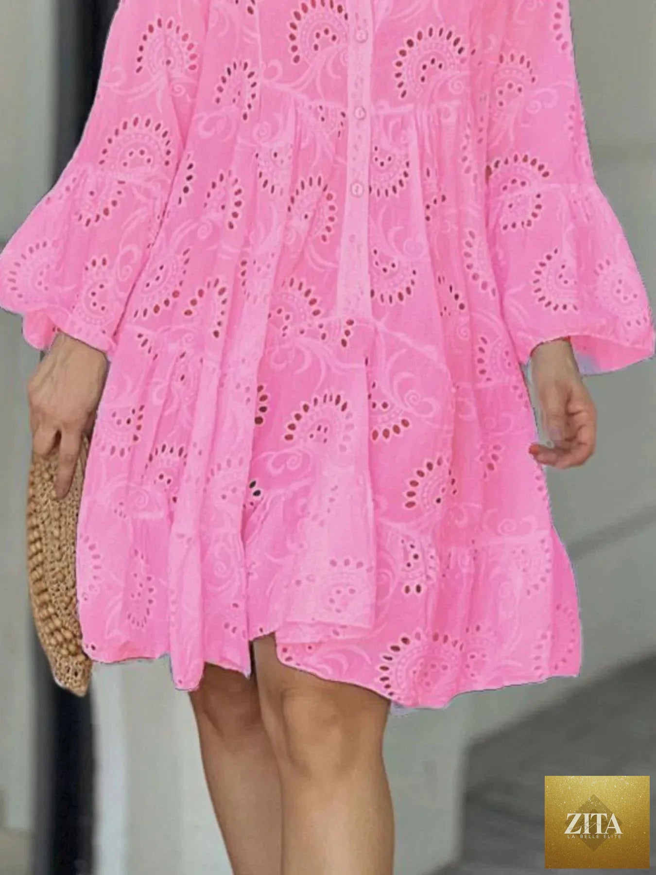 Eyelet ruffled hem tiered dress from Shopiebay featuring a feminine design with layered ruffles and eyelet details.