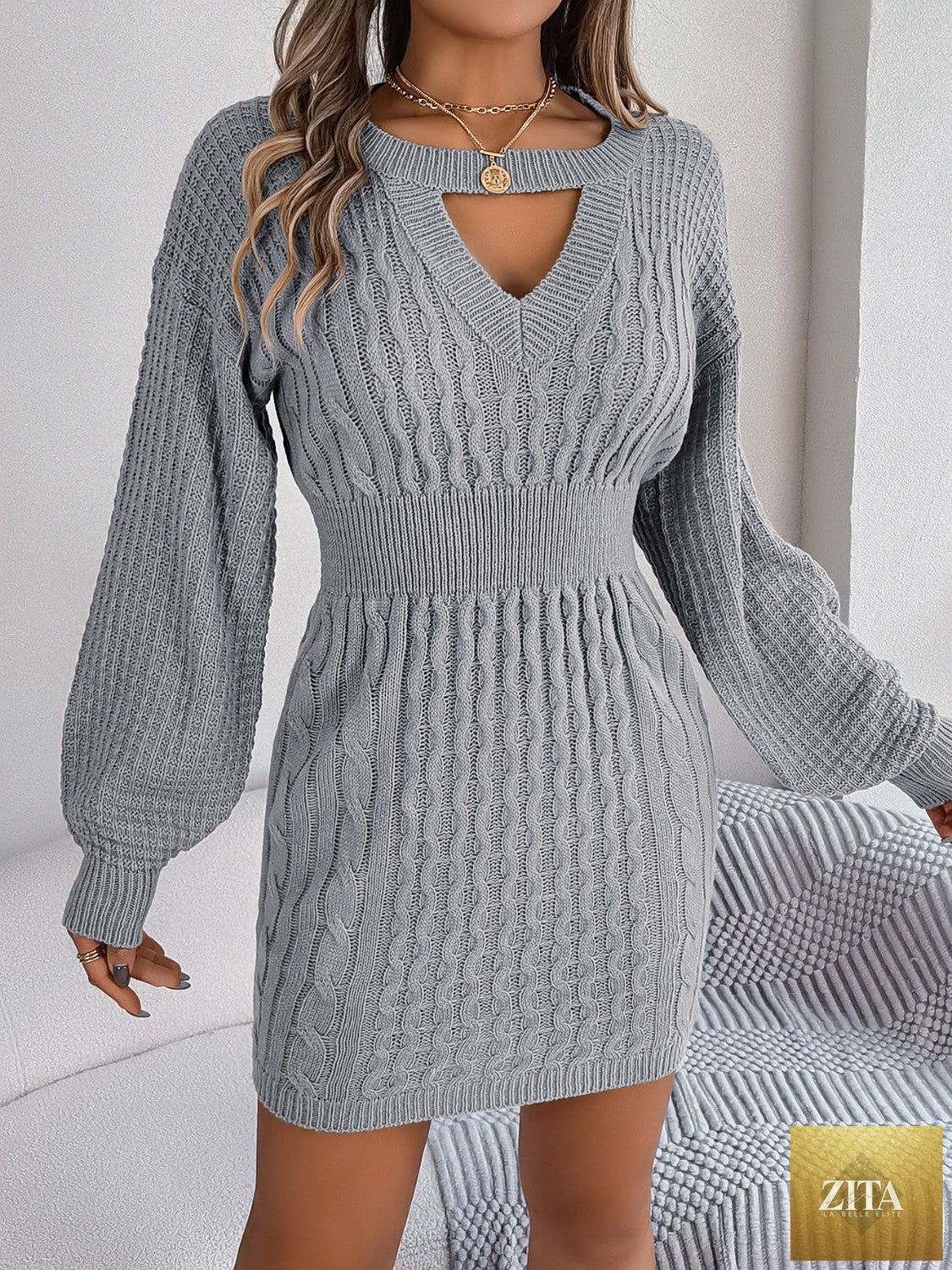 VYSN cable-knit sweater dress with cutout round neckline and side slit, stylish and cozy fashion piece.