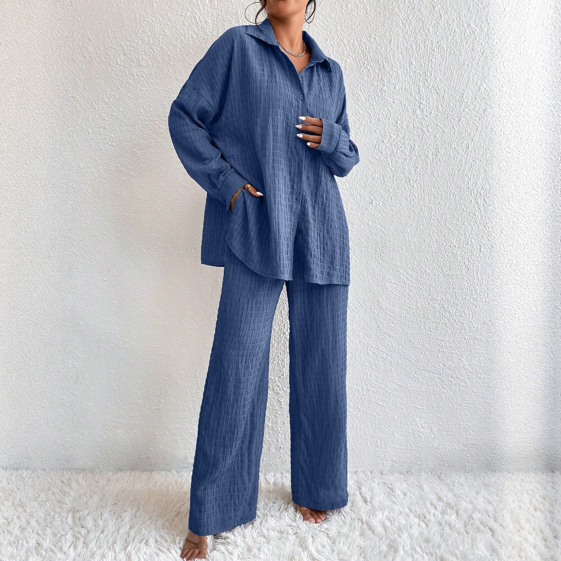 Women's pleated long sleeve lapel two-piece set by FitiqueFit featuring a loose top and matching pants, casualwear outfit.