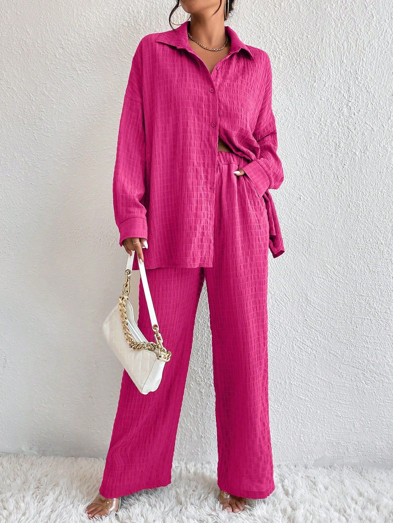 Women's pleated long sleeve lapel two-piece casualwear set by FitiqueFit, featuring a loose top and matching pants.