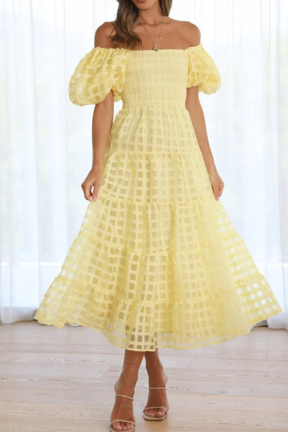 Off shoulder short puff sleeve midi dress by Shopiebay, featuring a stylish neckline and flowy silhouette in soft fabric.