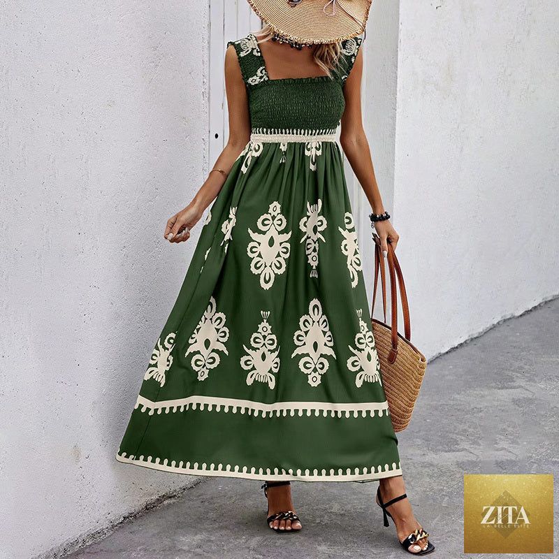 Women's printed maxi dress by MERIDGE with wide straps, smocked bodice, tassel waist, and flowing design.