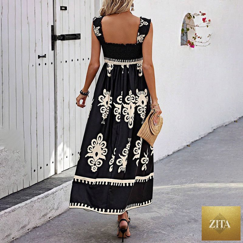 Women's wide-strap printed maxi dress by MERIDGE with smocked bodice and tassel waist, featuring vibrant floral pattern.