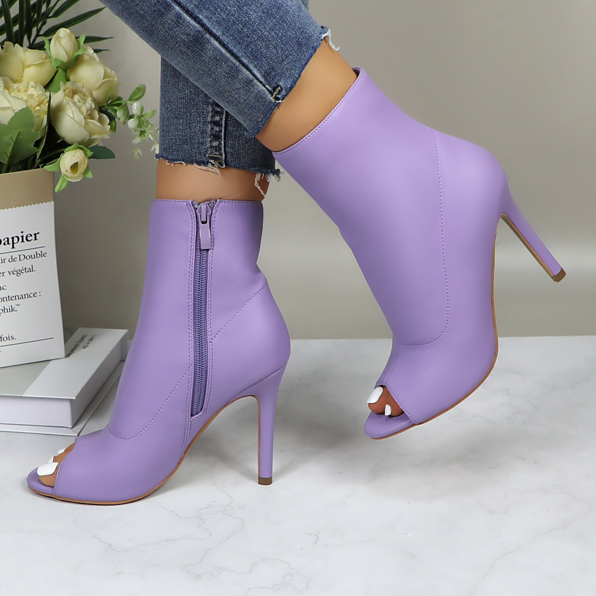 Shiny metallic stiletto boots for women with a sleek dance party style, featuring a high heel and reflective finish.