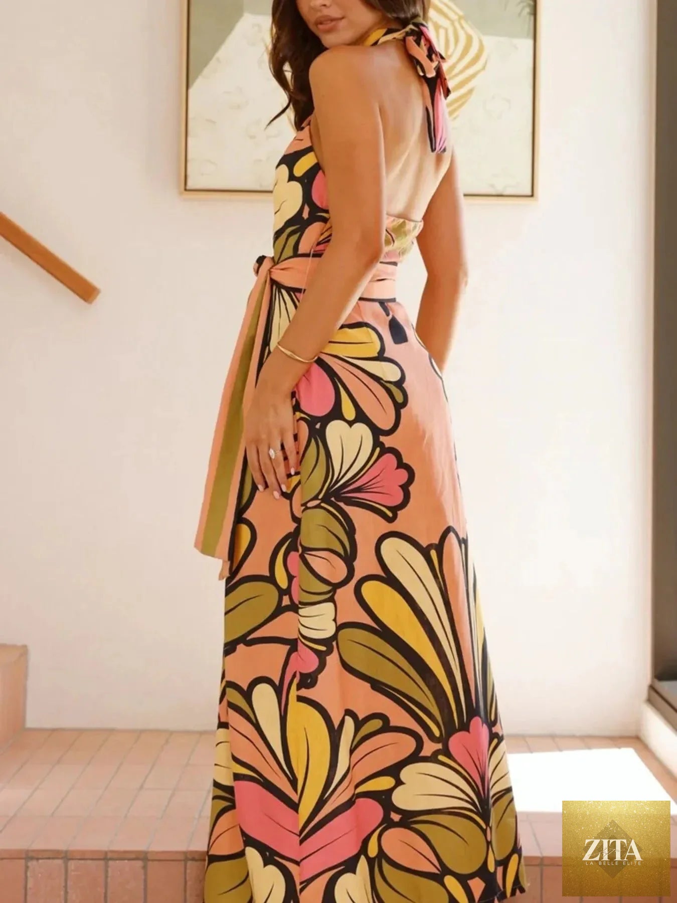 Printed halter neck maxi cami dress from Shopiebay featuring vibrant patterns and flowing fabric, perfect for summer occasions.