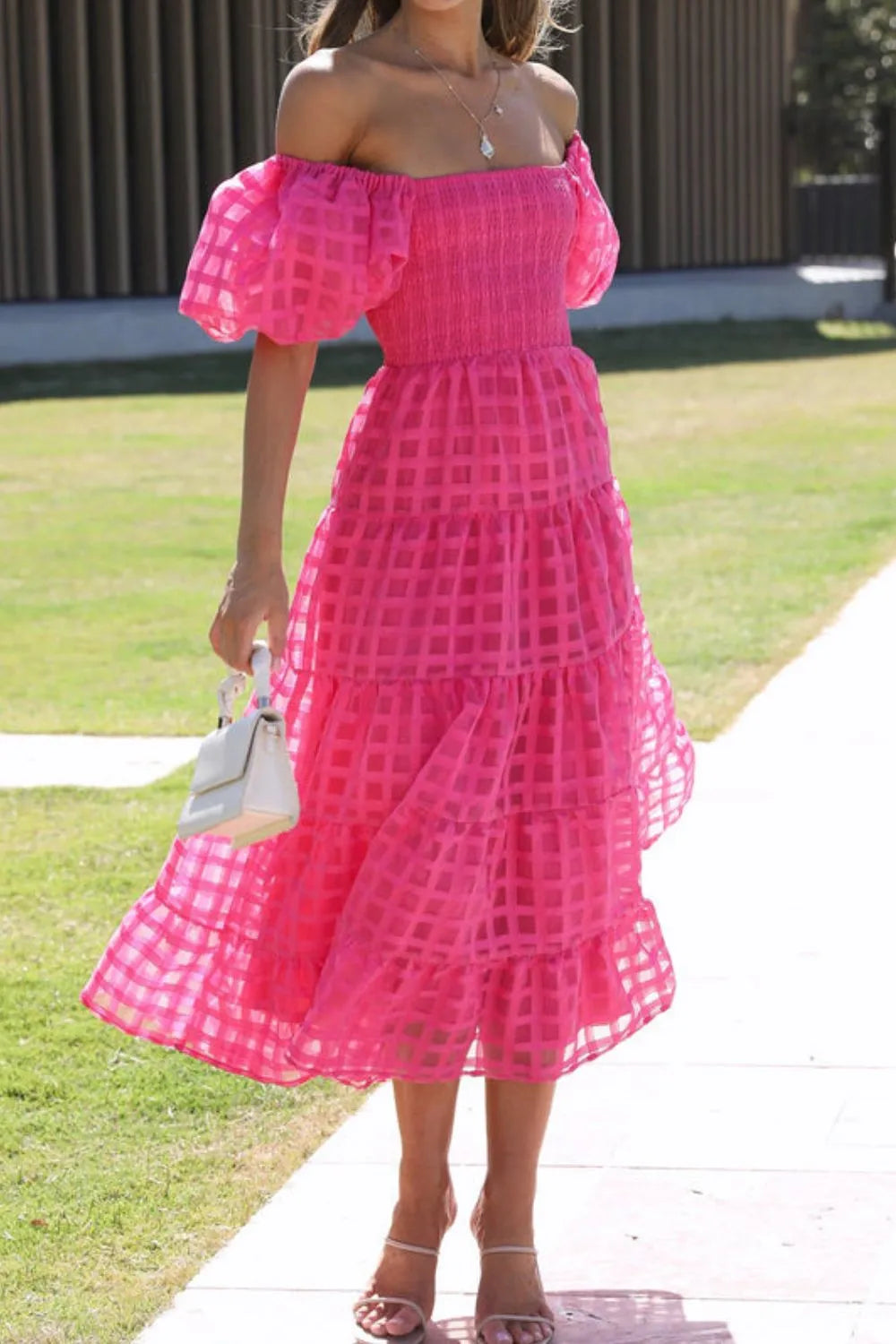 Off shoulder short puff sleeve midi dress by Shopiebay, featuring a feminine silhouette and stylish design, shown on a model.
