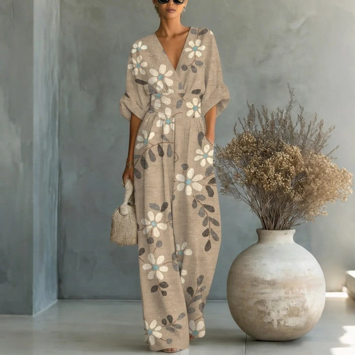 Women's waist-cinched V-neck printed wide-leg jumpsuit by FitiqueFit, showing the casualwear design with a flattering silhouette.