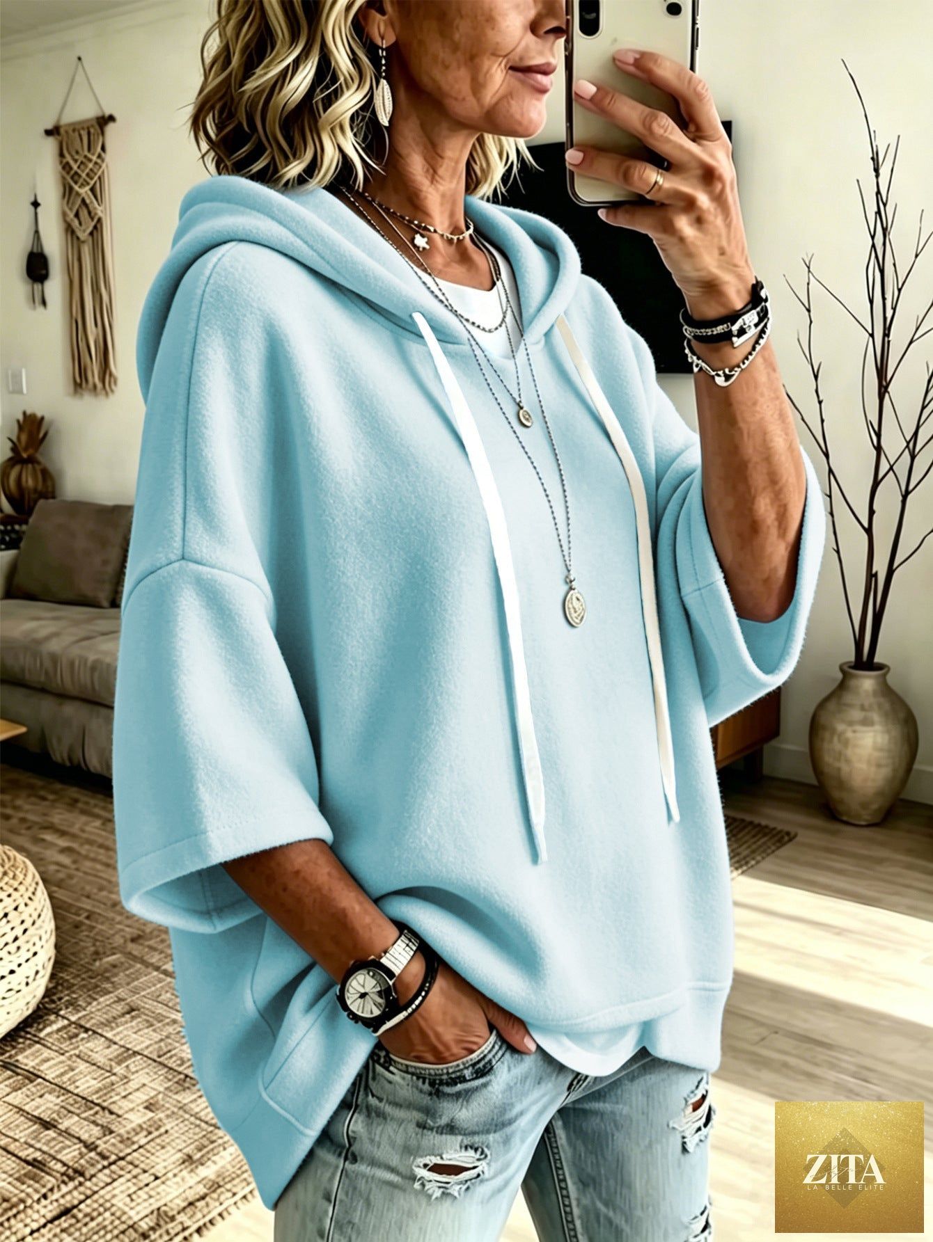 Women's oversized batwing sleeve hoodie by FitiqueFit featuring a loose fleece pullover with a relaxed fit and stylish batwing design.