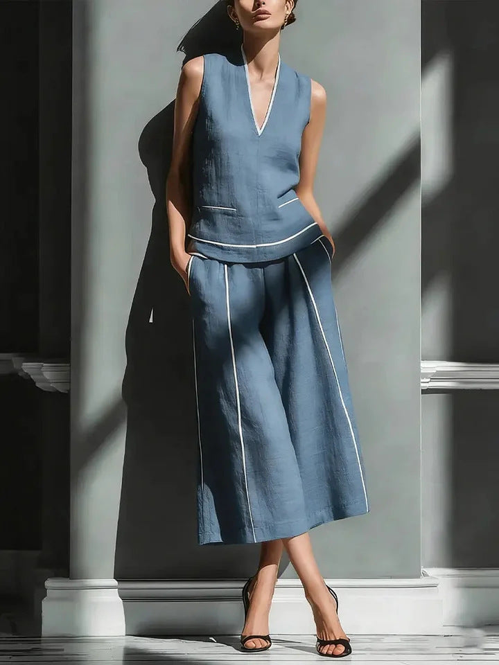 Women's sleeveless linen shirt and cropped pants set by FitiqueFit, casualwear 2-piece outfit, worn for relaxed daytime style.