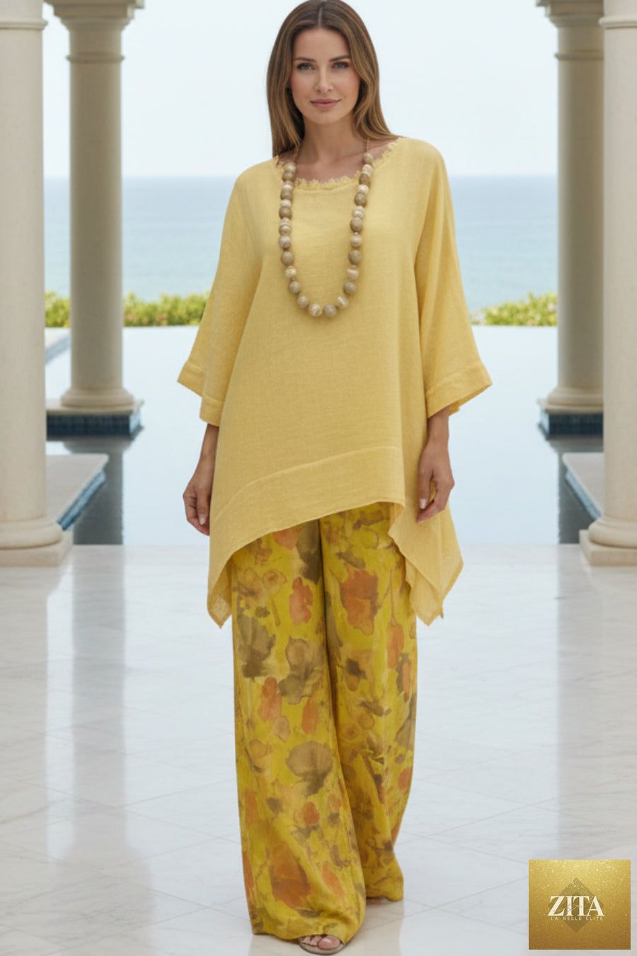 Women's linen-style tunic top and watercolor floral wide-leg pants set by MERIDGE, featuring a relaxed two-piece outfit with vibrant print