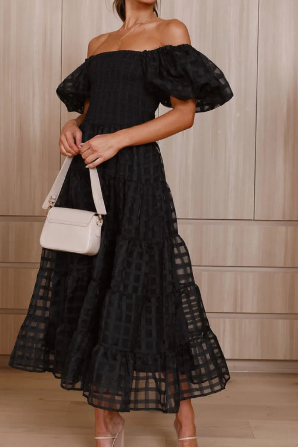 Off shoulder short puff sleeve midi dress by Shopiebay, shown in a stylish design with a fitted bodice and flowing skirt.