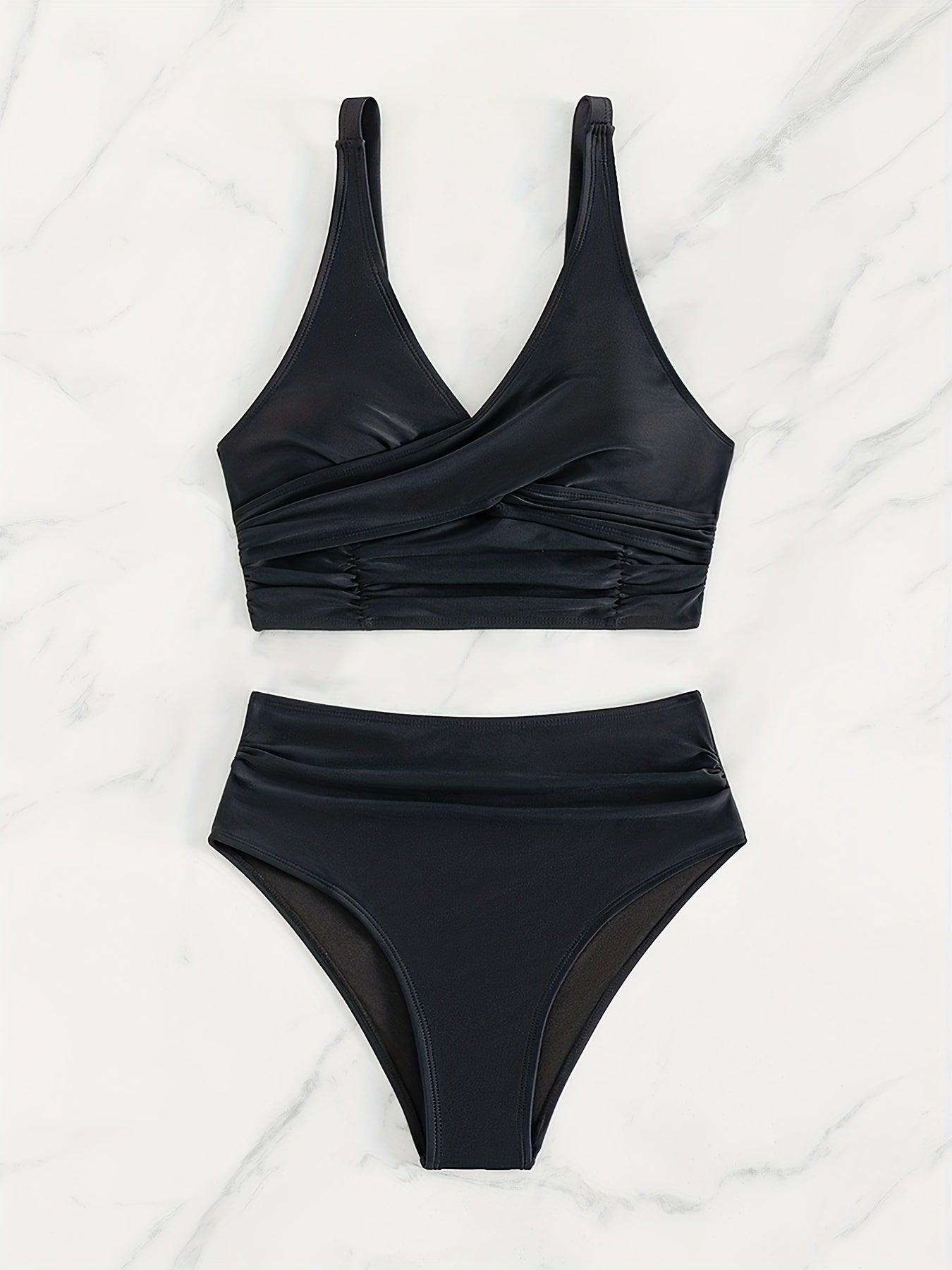 Solid black Stevvex bikini set with twist front, high waist, V-neck, ruched tummy control, and cross strap detail for women.