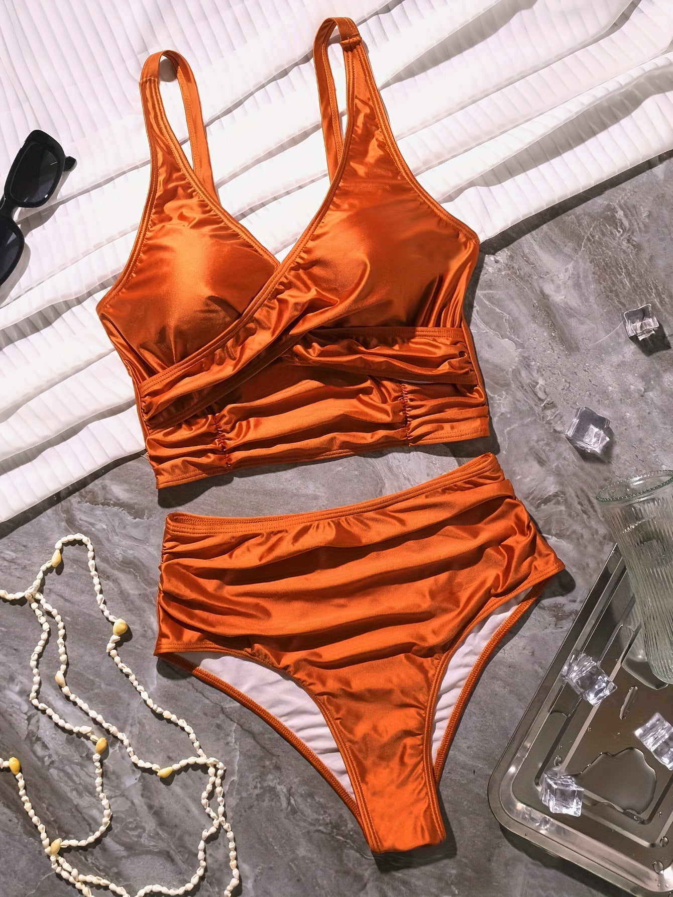 Black twist front high waist bikini set for women, featuring ruched tummy control, cross strap detail, and quick-drying polyamide fabric.