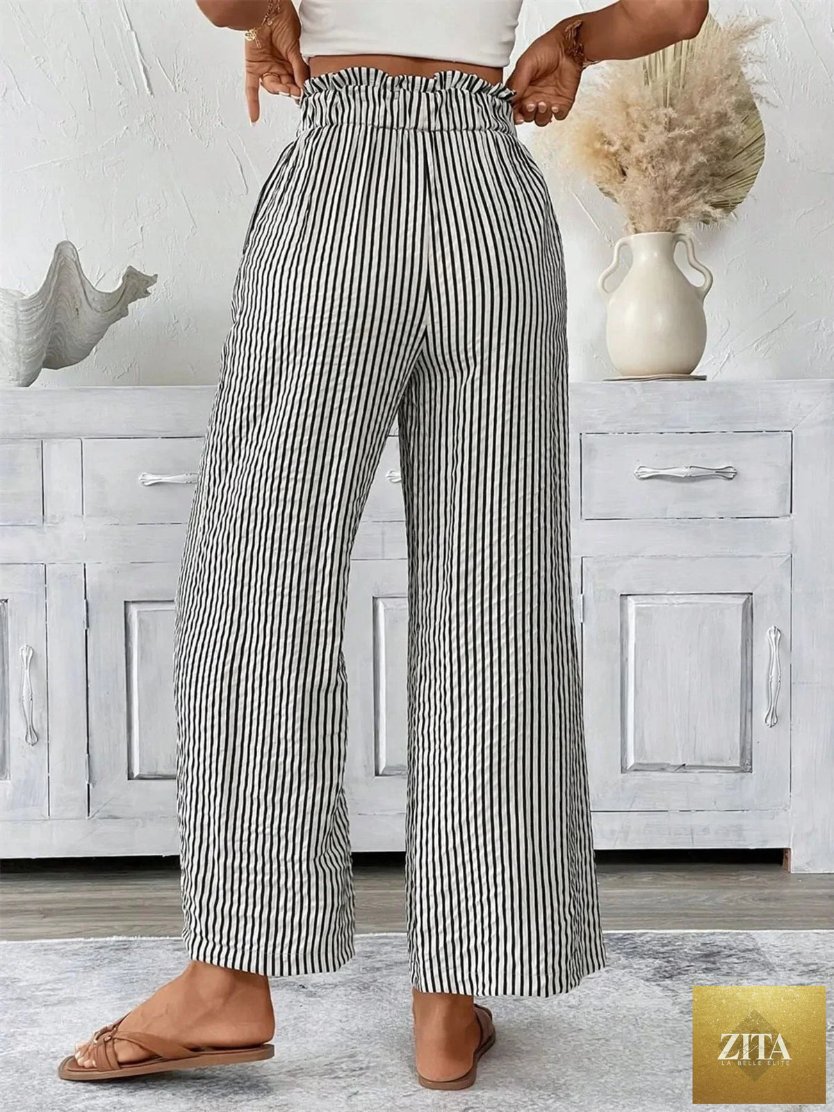 Full size SITRA striped wide-leg paper bag pants in plus size with a high waist and relaxed fit, shown on a model.