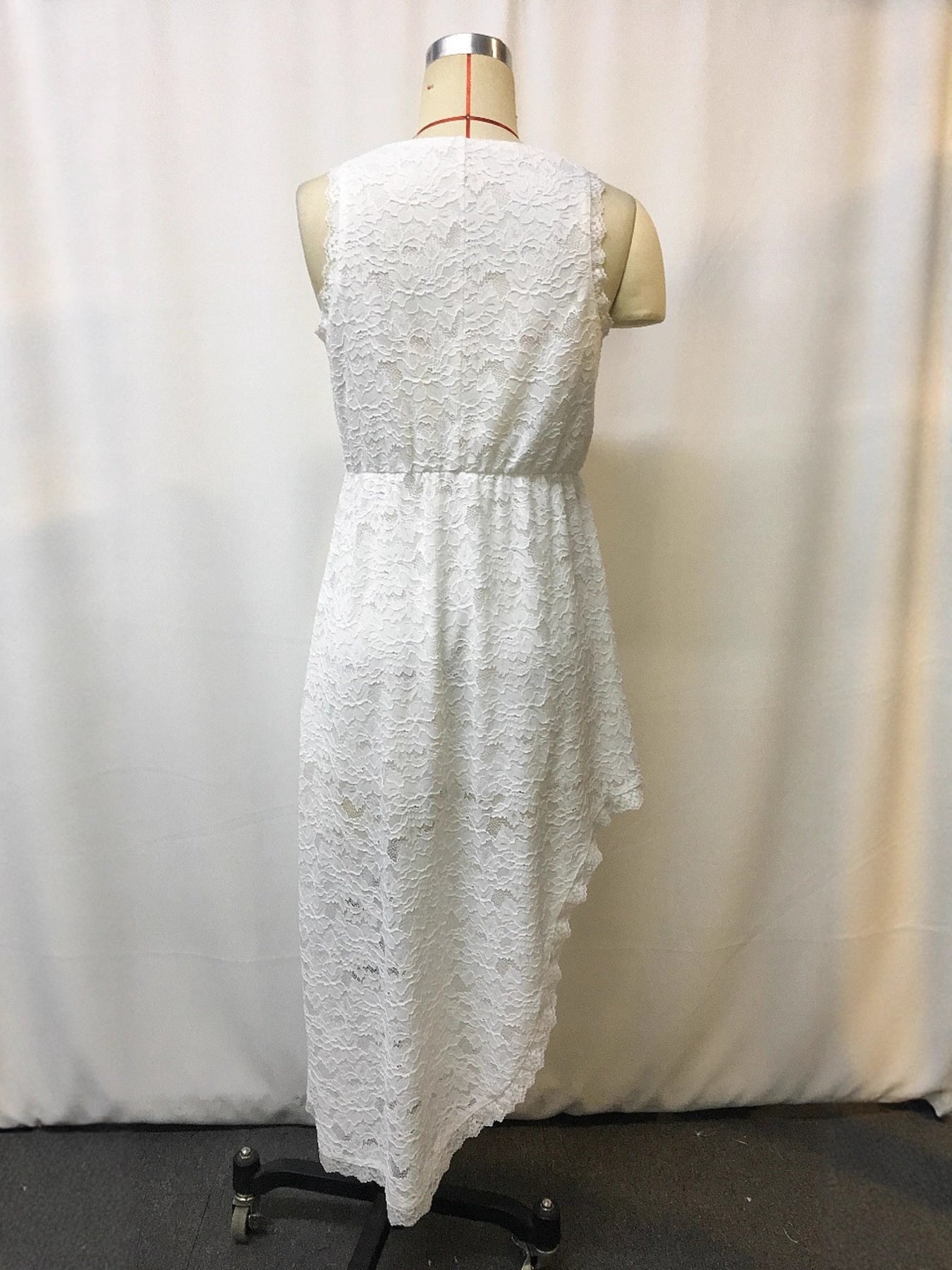 Plus size sleeveless lace dress with asymmetrical hem from Shopiebay, featuring a stylish, flowy design and elegant lace details.