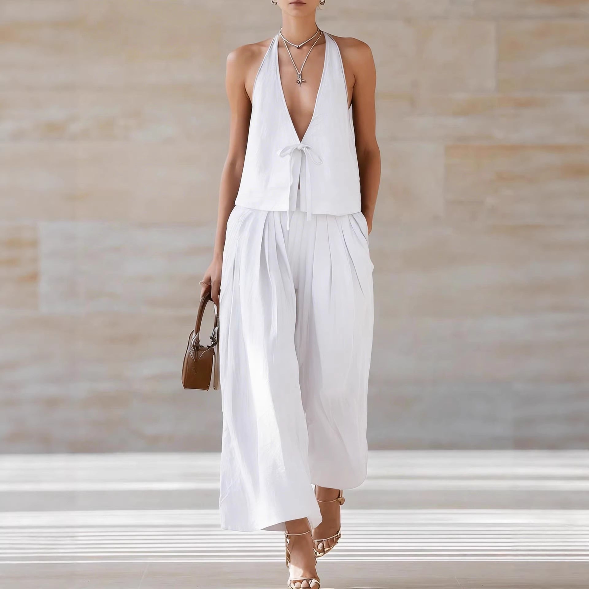 Women's sleeveless vest and wide-leg pants casualwear set by FitiqueFit, featuring a stylish lace-up design and comfortable fit.