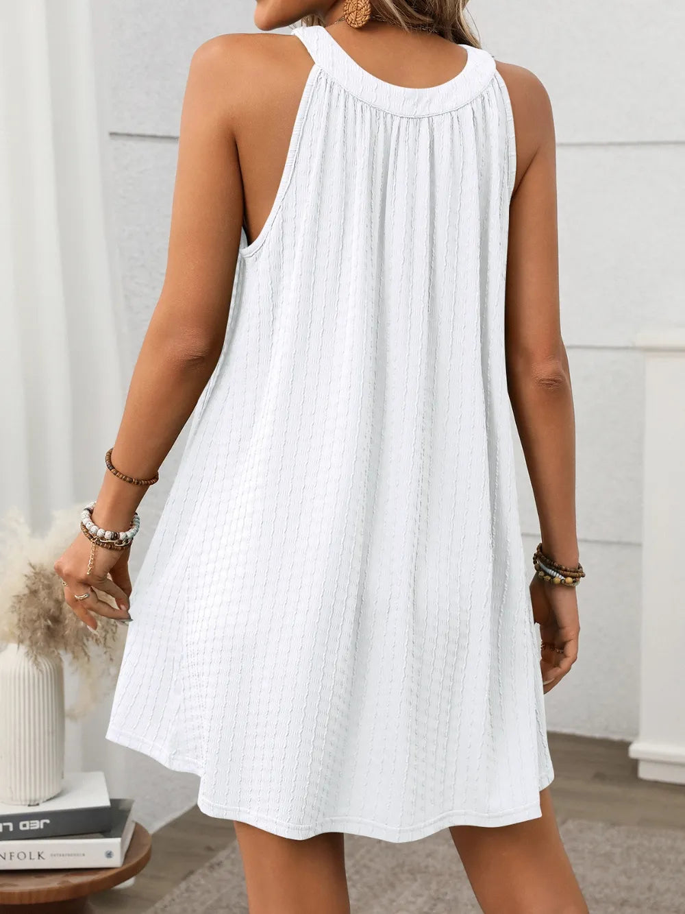 Textured Grecian Neck Mini Dress by Shopiebay featuring a fitted silhouette and elegant draped design on a model.