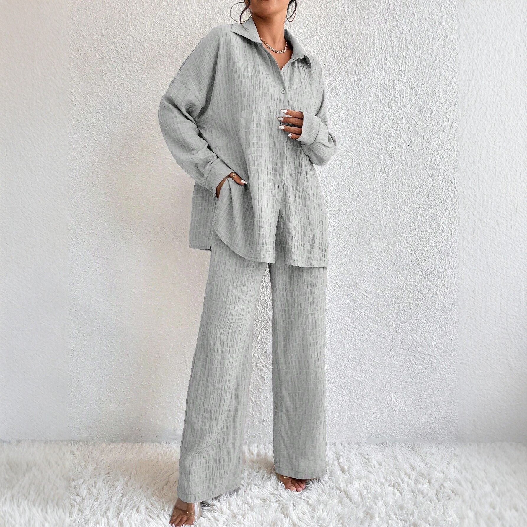 Women's casual two-piece set by FitiqueFit featuring a pleated long sleeve lapel top and matching pants.