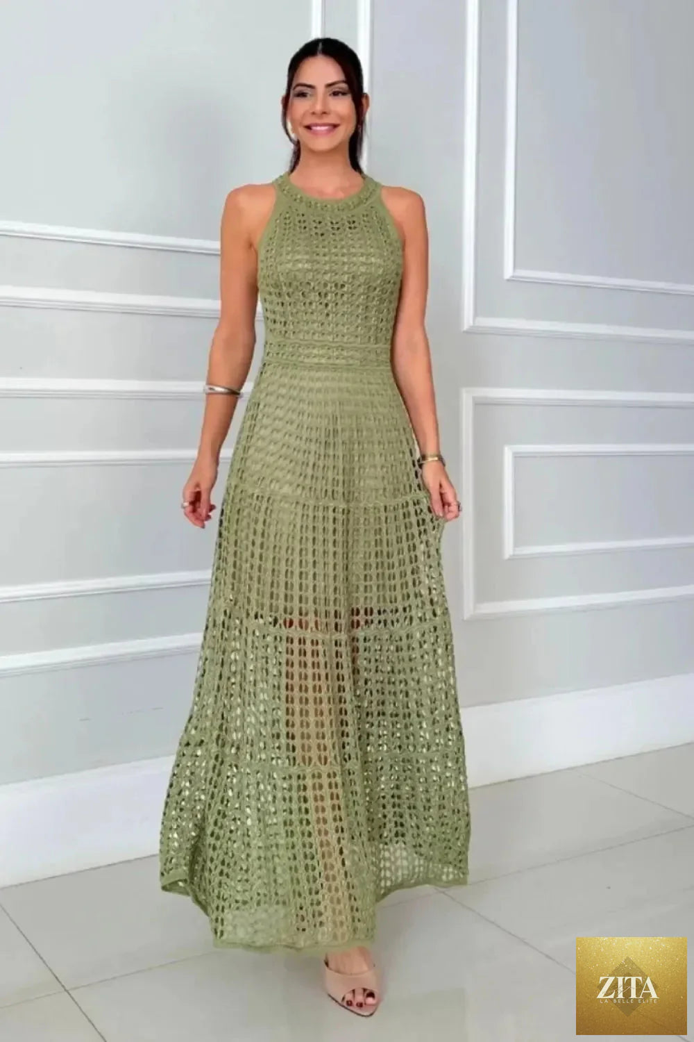 Hollowed-out sleeveless maxi dress by Shopiebay featuring a flowy silhouette and stylish cut-out details.