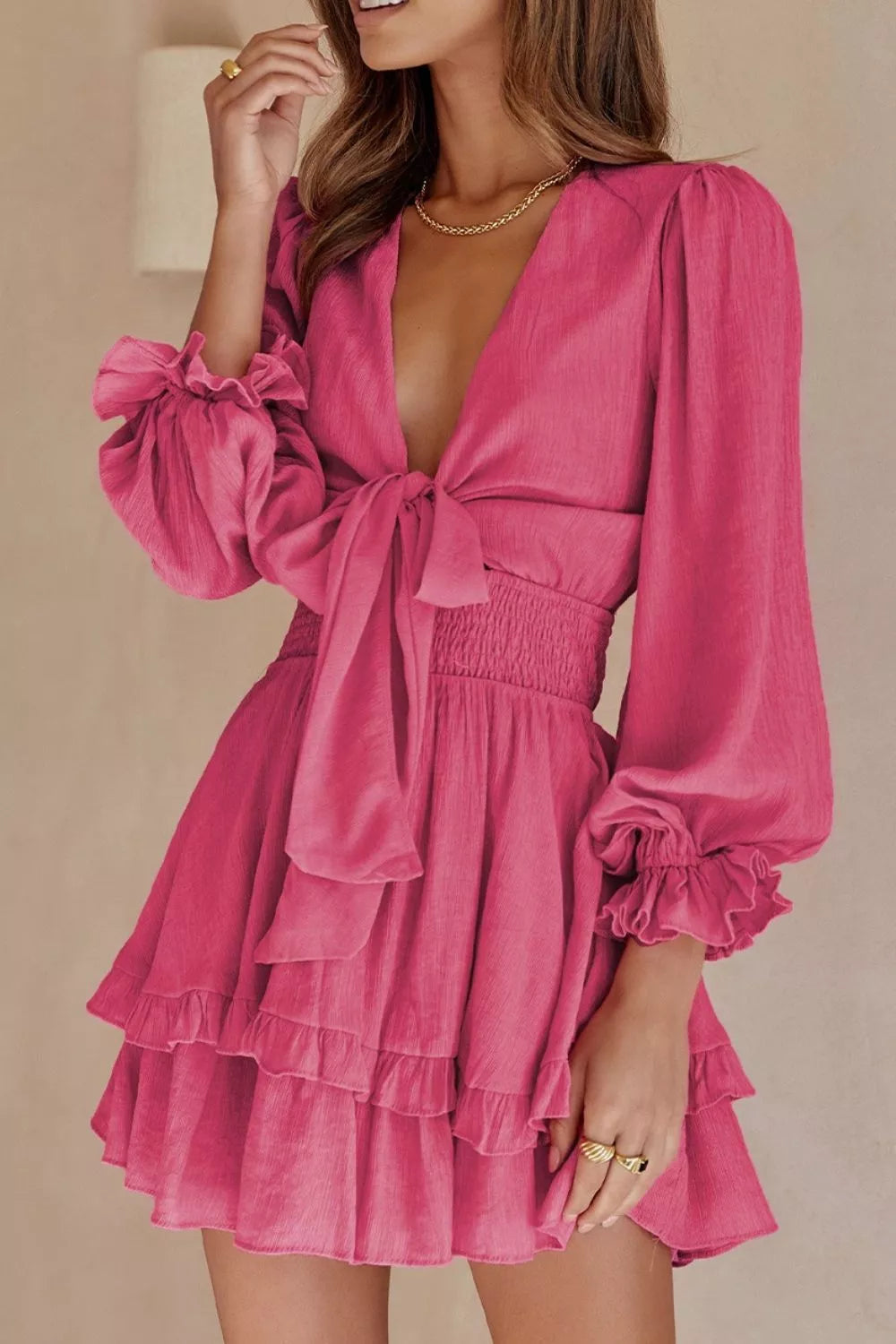 Elegant tie-front ruffle mini dress with smocked waist by Shopiebay, featuring a flattering neckline and feminine ruffle details.