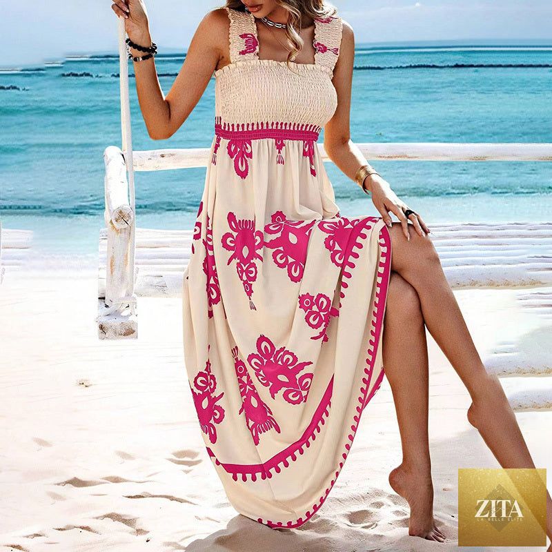 Women's wide-strap printed maxi dress by MERIDGE with smocked bodice and tassel waist, flowing fabric and vibrant pattern.