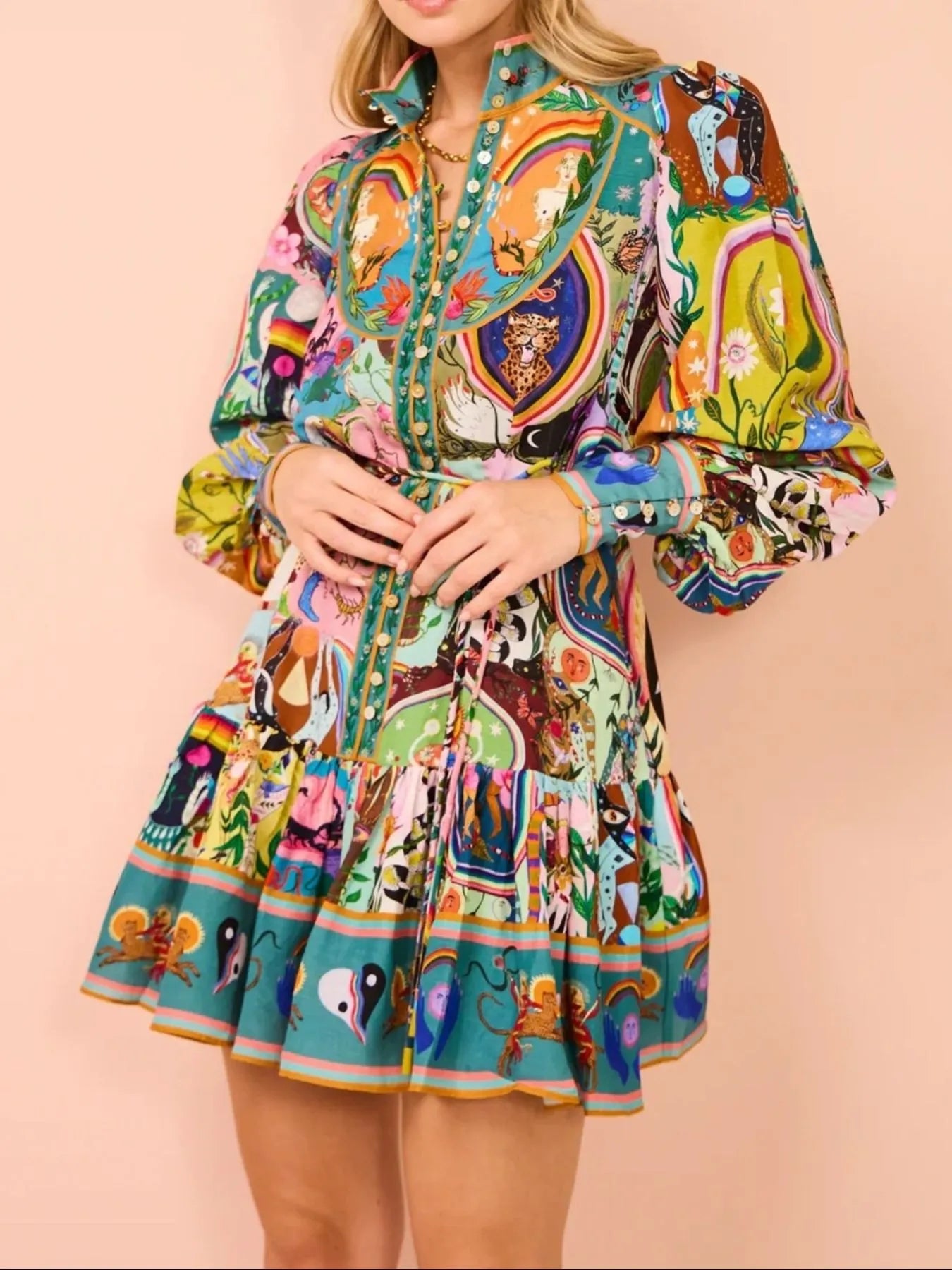 Printed long sleeve mini dress with belt by Shopiebay, featuring a stylish design and fitted silhouette in the image.