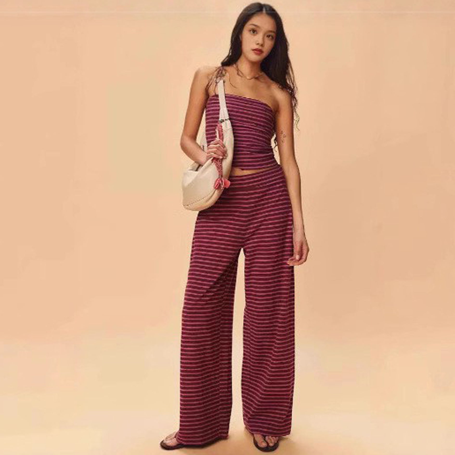 Women's striped tube top and matching pants set by FitiqueFit, casualwear, featuring a fitted tube top and comfortable striped pants.