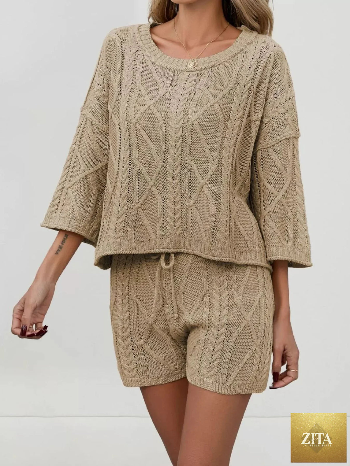 SITRA cable knit round neck top and shorts sweater set in cozy, textured knit fabric, perfect for casual wear.