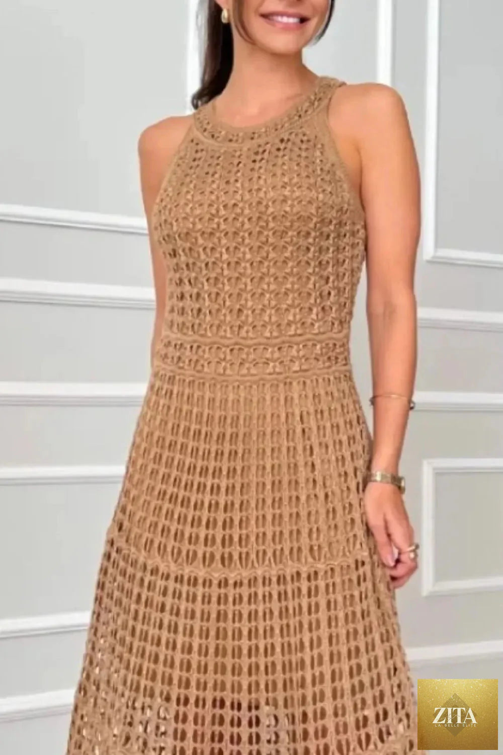 Hollowed-out sleeveless maxi dress by Shopiebay featuring a flowy silhouette and stylish cut-out details, perfect for summer wear.