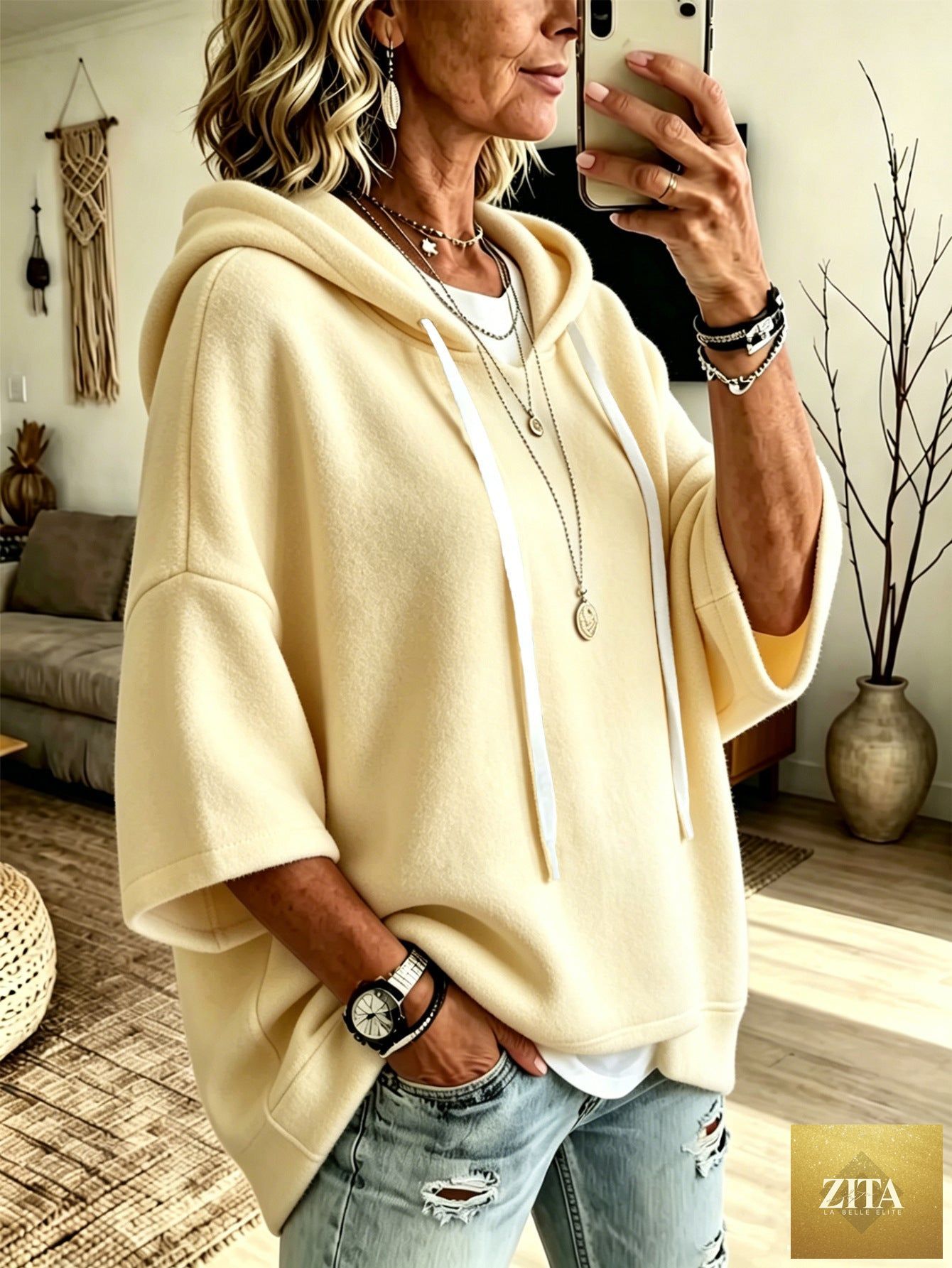 Women's oversized FitiqueFit batwing sleeve hoodie with loose fleece fabric, featuring a relaxed fit and cozy design.