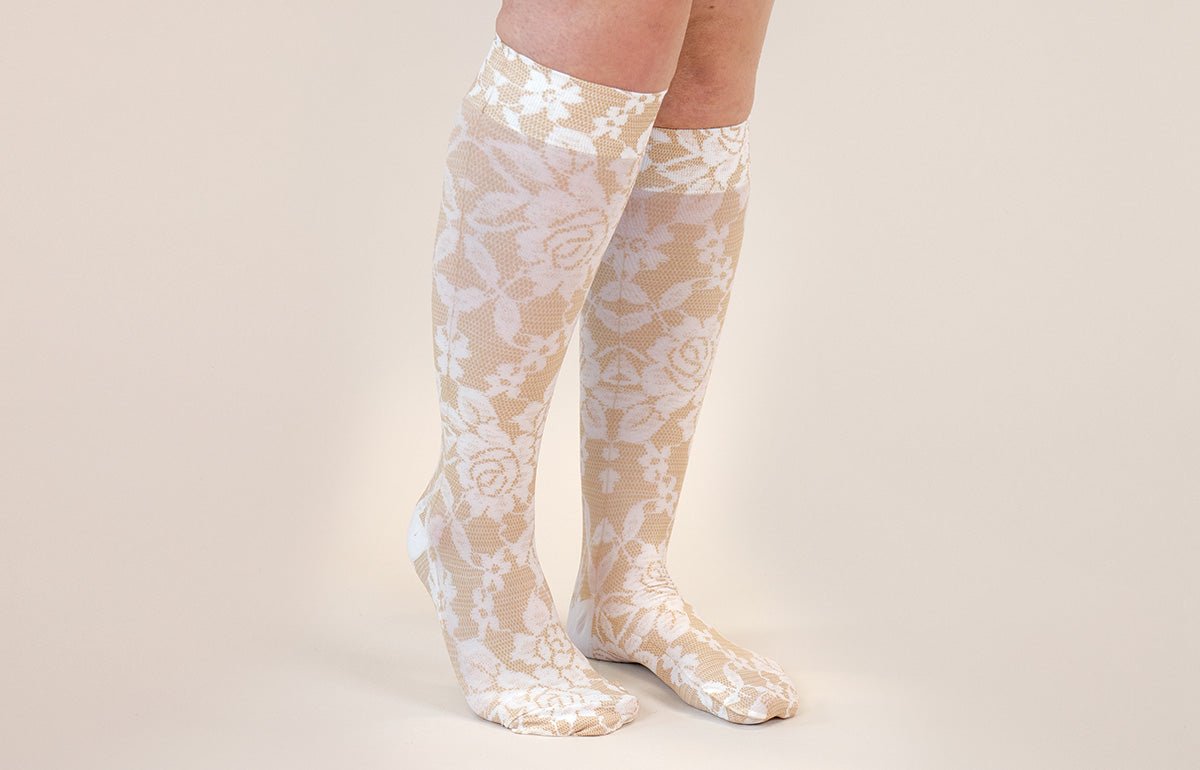 LympheDIVAs Darling Tan gradient compression socks with stylish design and graduated compression for improved circulation.