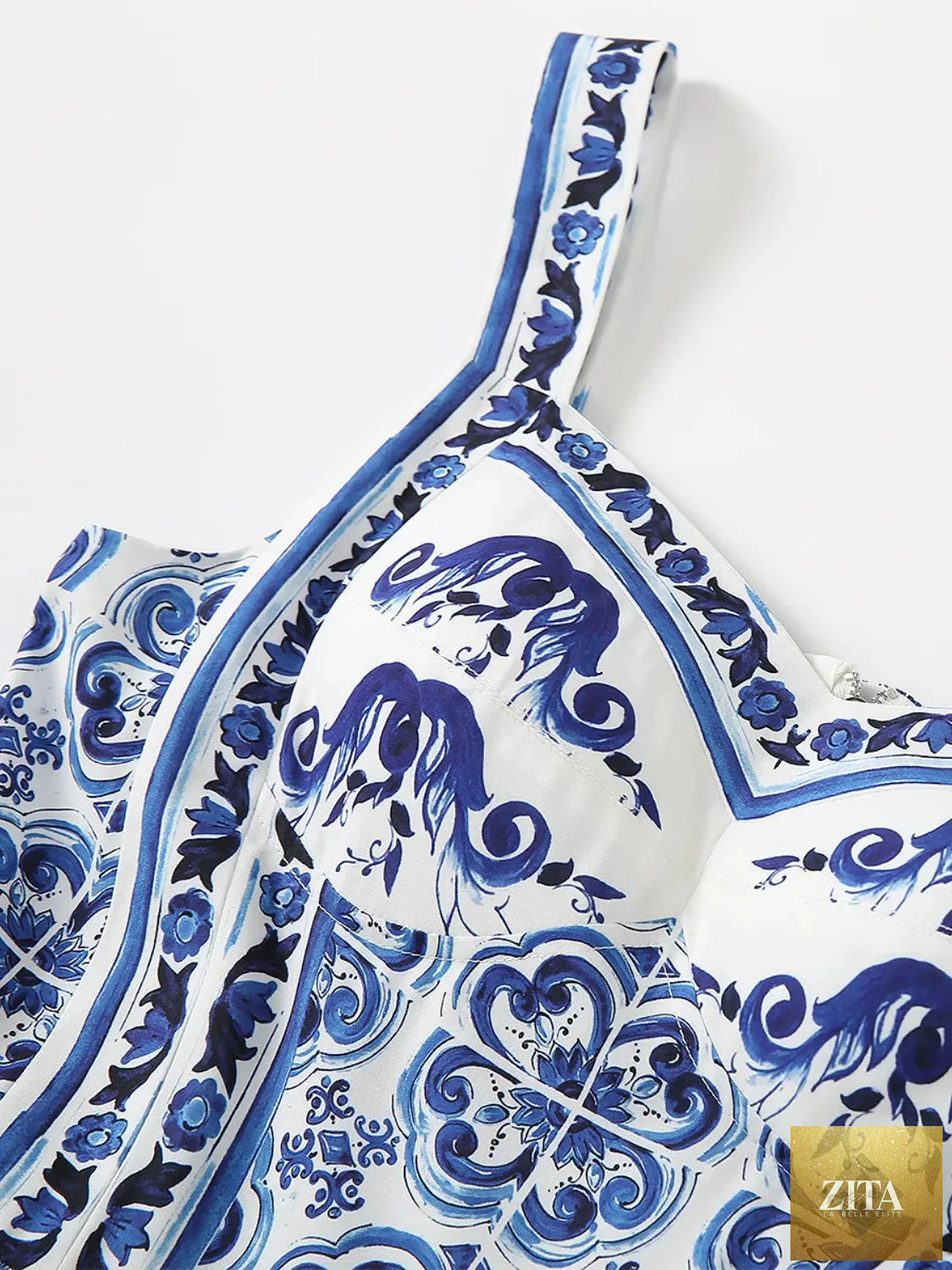 Smocked printed wide strap dress by Shopiebay featuring a flowy design and vibrant floral pattern on lightweight fabric.