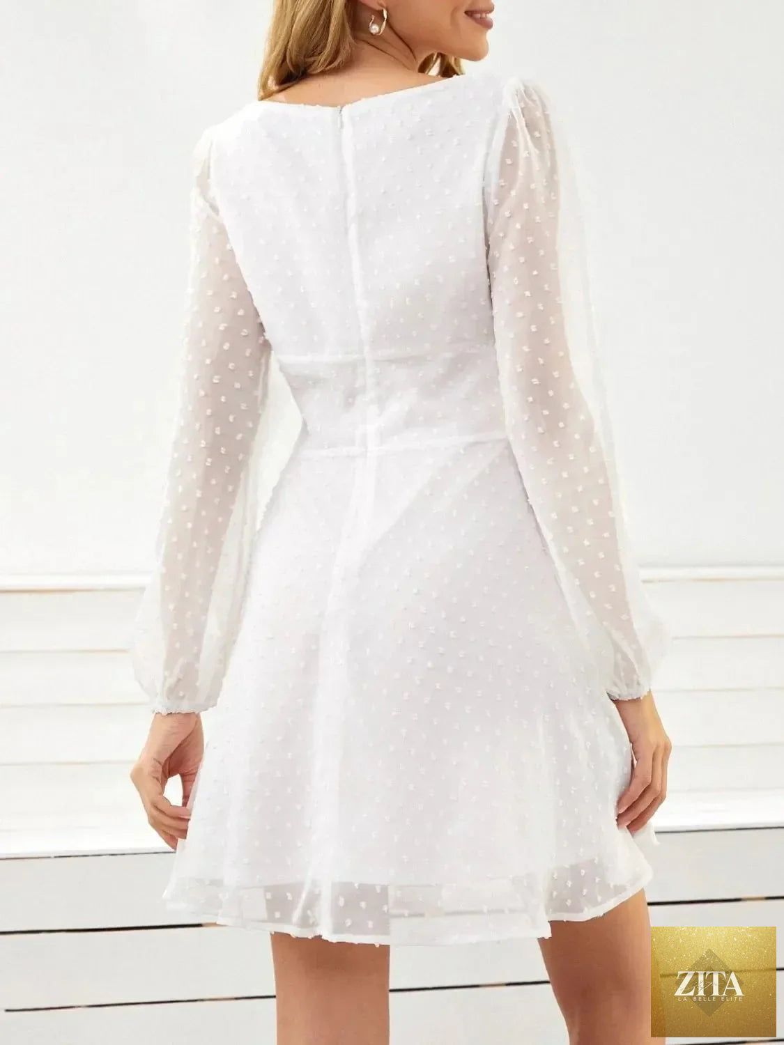 Swiss Dot long sleeve mini dress by Shopiebay featuring a fitted silhouette and delicate dot pattern on lightweight fabric.