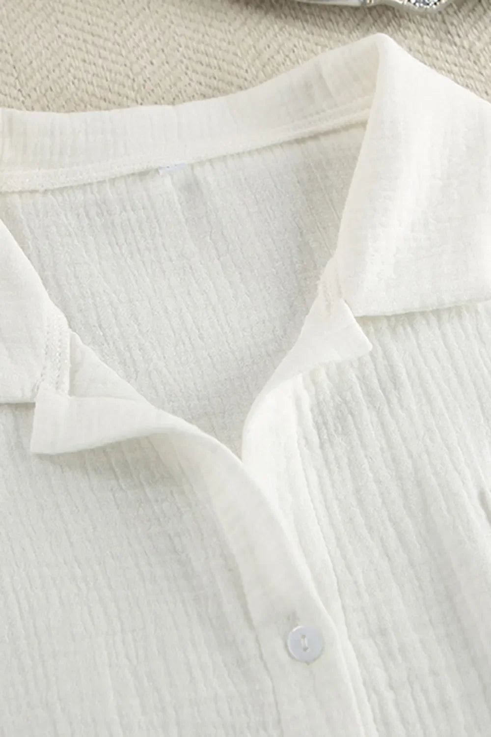 Basic Bae heart collar button-down top and shorts set, featuring a cute heart detail and relaxed fit in soft fabric.