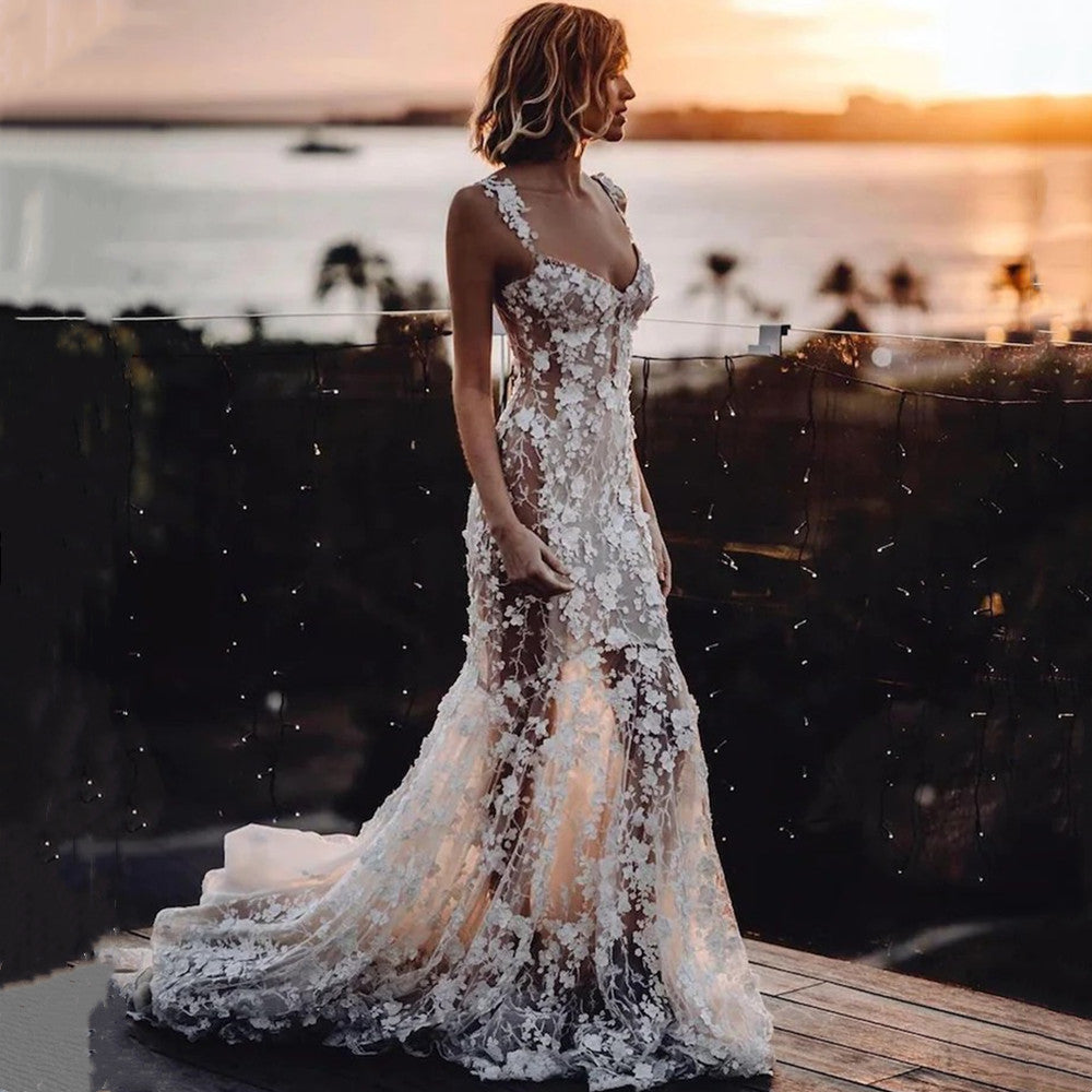 Elegant mermaid wedding dress by FLIPSTYLEZLLC with intricate 3D lace appliques and a fitted silhouette.