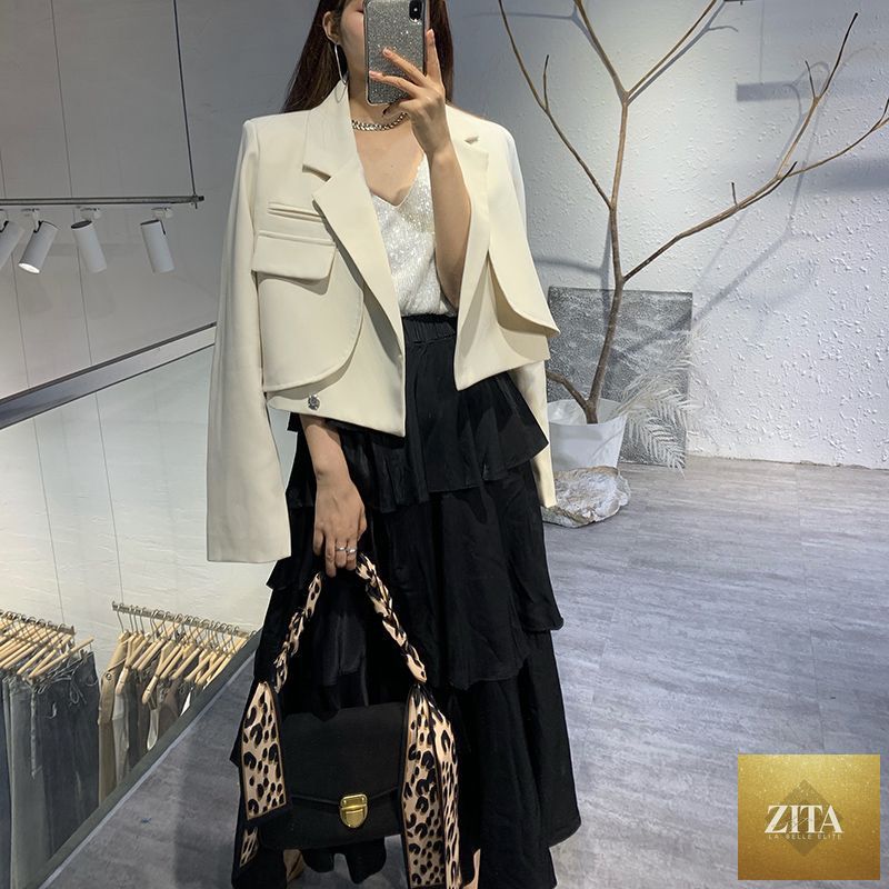 Elegant versatile women's blazer by Social Buzz eSIMs, shown in classic short style with tailored fit and stylish lapels.